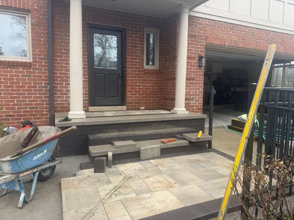 Custom paver patio rebuild in Bloomfield Hills Village with retaining wall and modern outdoor design