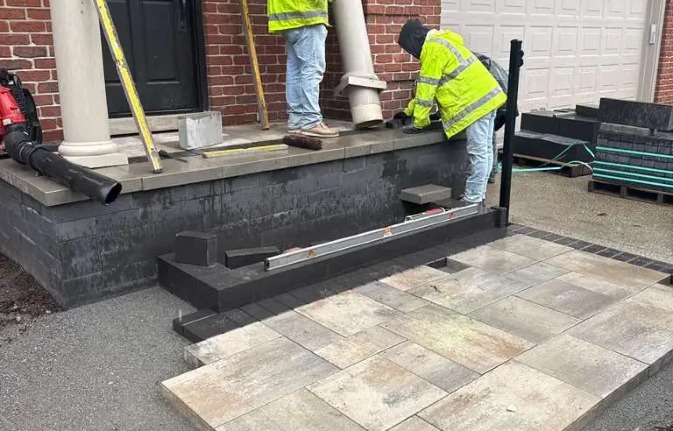Rear patio reconstruction in Bloomfield Hills with engineered gravel base and Unilock hardscape installation